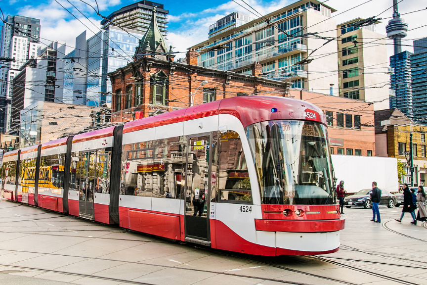 TTC street car with the CN tower in the background