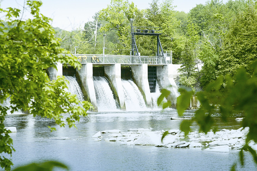 A hydro-electric dam in a body of water