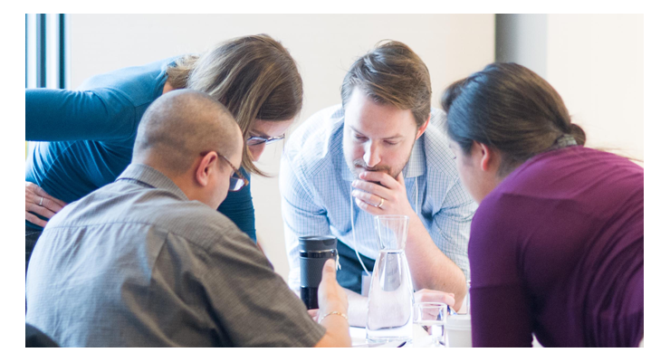 People looking at documents