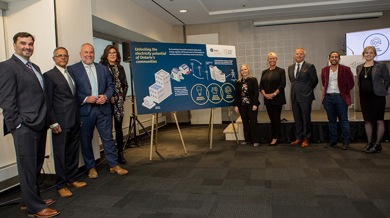 (L to R)  John Avdoulos, President and CEO of Essex Power Corporation; Suriya Panditi, Head of Enel X North America; Minister of Energy Todd Smith; Susanna Zagar, President of OEB; Lesley Gallinger, President and CEO of IESO; Carla Y. Nell, VP of Corporate Relations, Stakeholder Engagement and Innovation; Anthony Haines, President and CEO of Toronto Hydro; Imran Noorani, Chief Strategy Officer, Peak Power; Janet Taylor, Oshawa Power